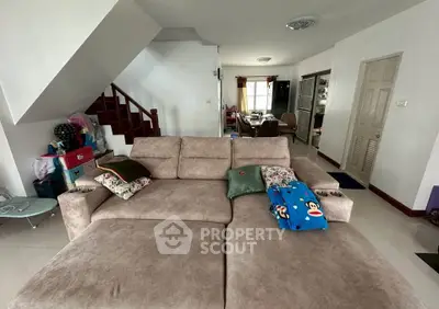 Spacious living room with cozy sofa and modern decor