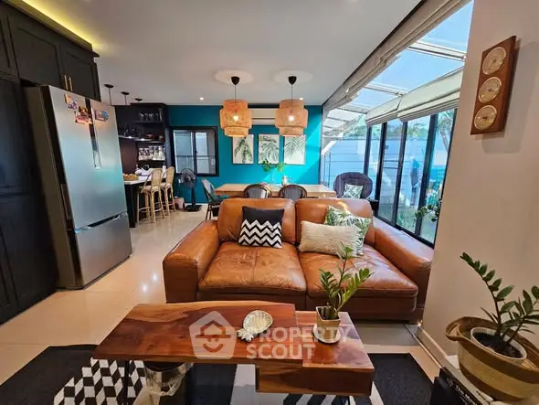 Spacious open-plan living room with modern kitchen and natural light