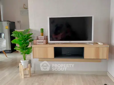 Modern living room with wall-mounted TV and stylish decor