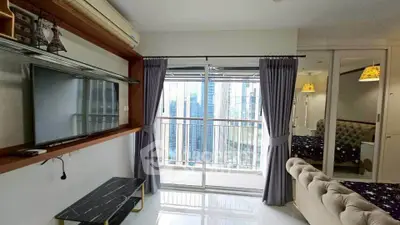 Modern living room with balcony view in high-rise apartment