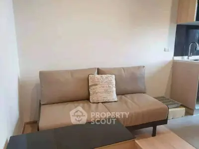 Modern living room with sleek sofa and stylish decor in a contemporary apartment.