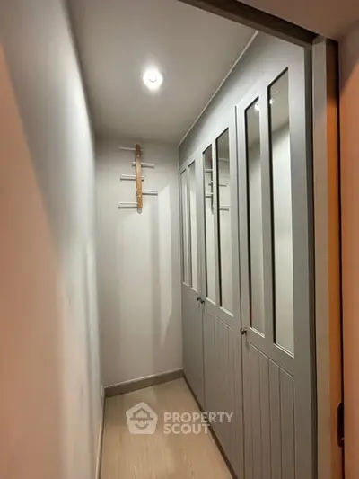 Modern hallway with built-in storage and sleek lighting