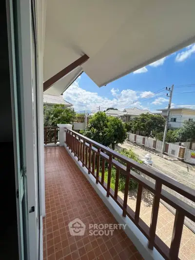Spacious balcony with scenic view in a modern residential area, perfect for relaxation and outdoor enjoyment.
