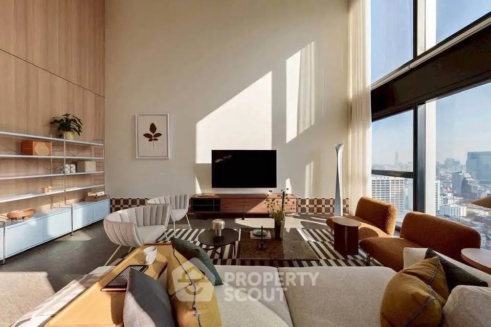 Luxurious high-rise living room with panoramic city views and modern decor.