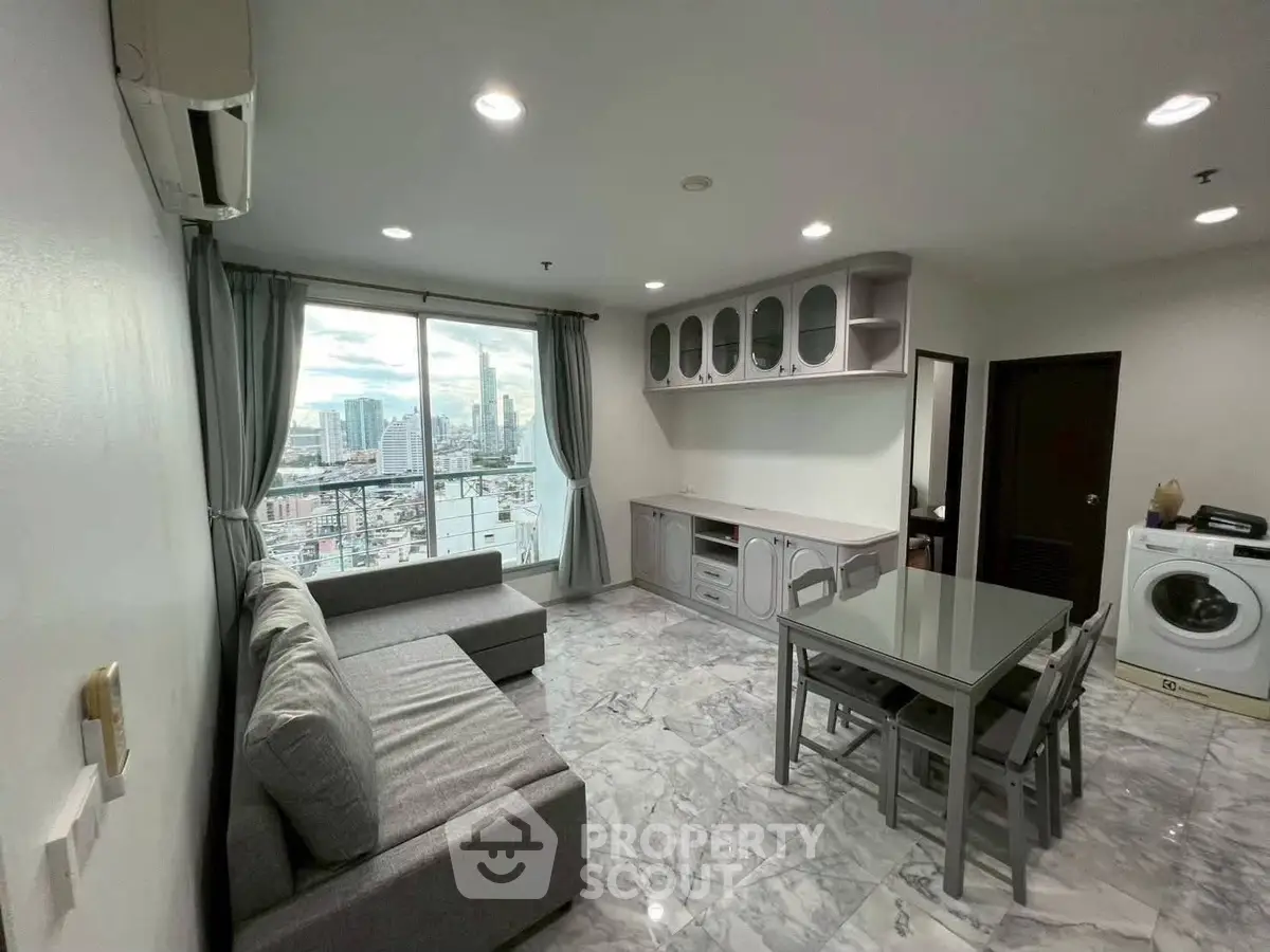 Modern living room with city view, marble flooring, and sleek furniture for urban lifestyle.