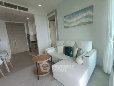 Modern living room with white sofa and stylish decor in a contemporary apartment.