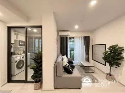 Modern living room with washing machine and stylish decor