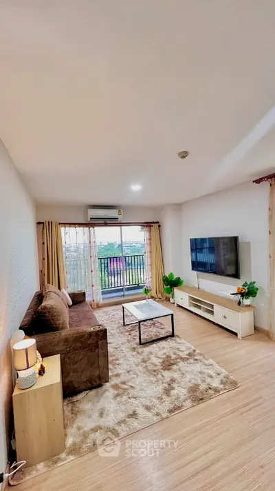 Spacious living room with modern decor and balcony view