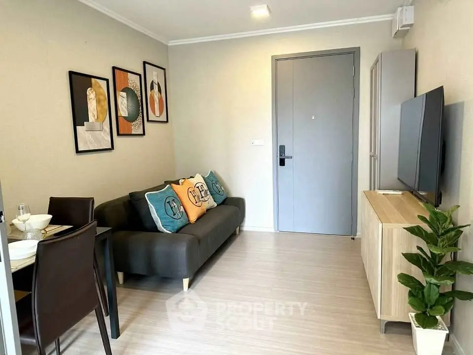 Modern living room with stylish decor and cozy seating in a contemporary apartment.