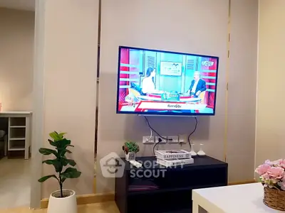 Modern living room with wall-mounted TV and stylish decor