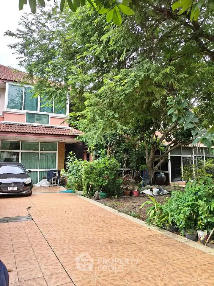 Charming suburban home with lush garden and spacious driveway, perfect for family living.