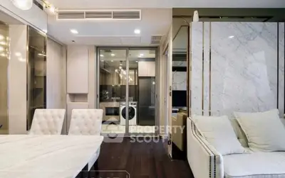 Luxurious modern living room with elegant furniture and open kitchen view