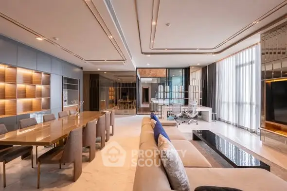 Luxurious open-plan living and dining area with modern decor and ample natural light.