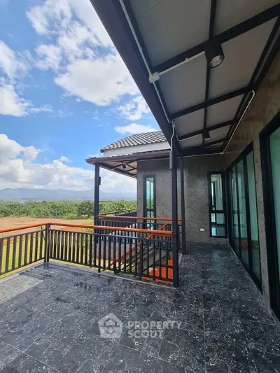 Stunning modern balcony with panoramic views and sleek design, perfect for relaxation and enjoying nature.