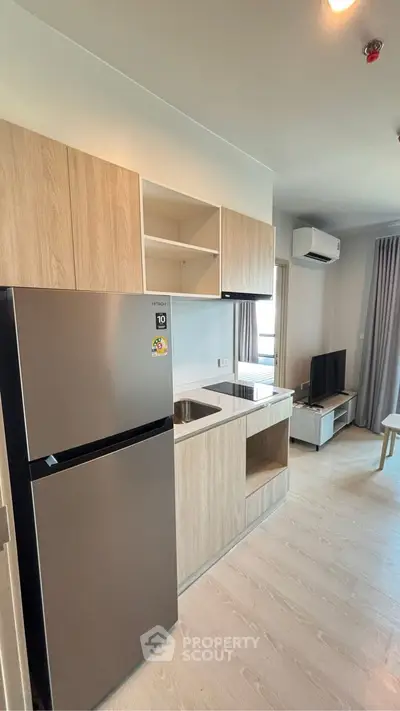 Modern kitchen with sleek appliances and open layout in stylish apartment