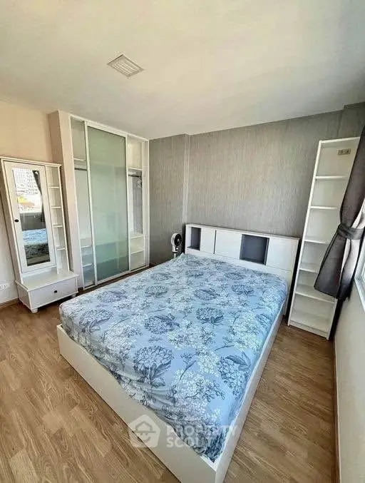 Modern bedroom with stylish decor and ample natural light