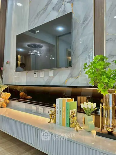 Luxurious living room with modern TV setup and elegant decor