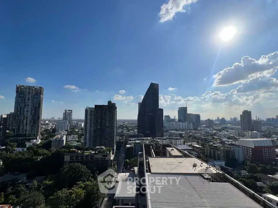 Stunning cityscape view with modern skyscrapers under a clear blue sky, perfect for urban living enthusiasts.