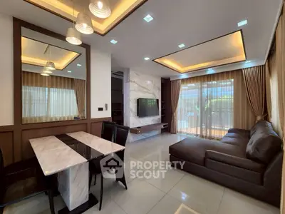 Luxurious modern living room with elegant marble accents and spacious seating area.