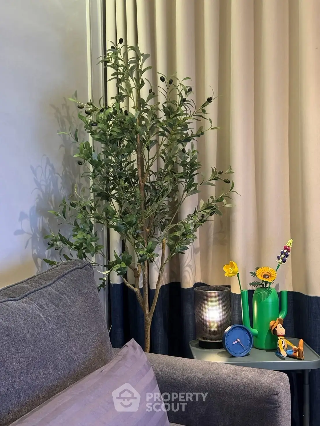 Cozy living room corner with stylish decor and indoor plant