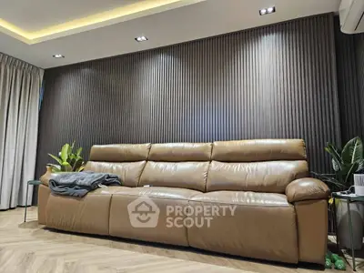 Luxurious modern living room with sleek leather sofa and elegant lighting
