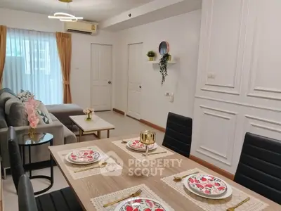 Stylish living room with elegant dining area and modern decor in a contemporary apartment.