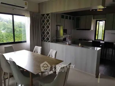 Modern kitchen and dining area with open layout and natural light