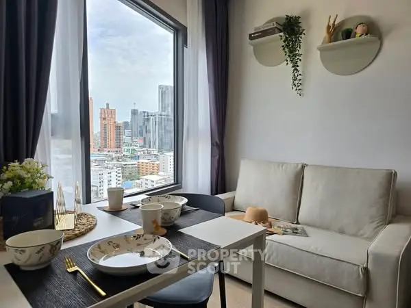 Chic urban living room with city view, modern decor, and cozy dining setup.