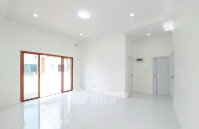 Spacious and bright living room with large windows and modern design