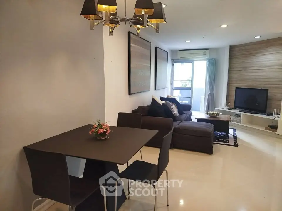Modern living room with stylish dining area and cozy seating, perfect for relaxation and entertainment.