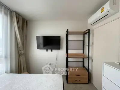 Modern bedroom with wall-mounted TV and sleek shelving unit