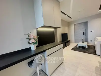 Modern living room with sleek furniture and stylish decor in a contemporary apartment.