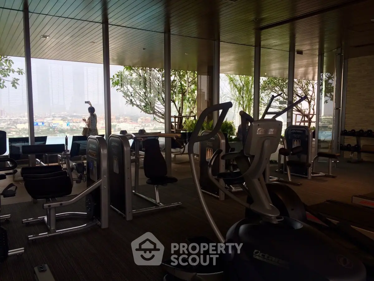 Luxurious gym with modern equipment and panoramic city views