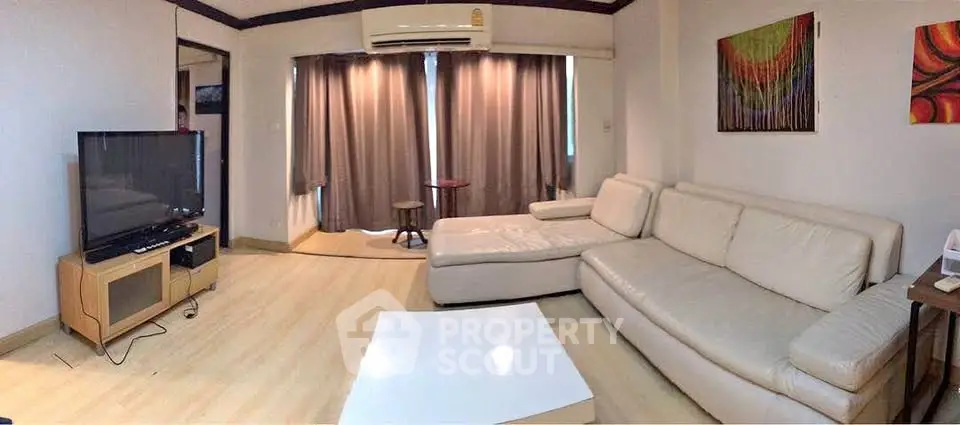 Spacious living room with modern decor and large sectional sofa