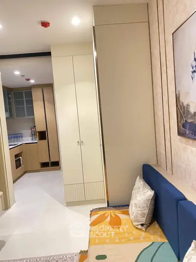 Modern apartment interior with cozy living area and stylish kitchen design.