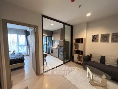 Modern open-plan apartment with cozy living area and stylish kitchen