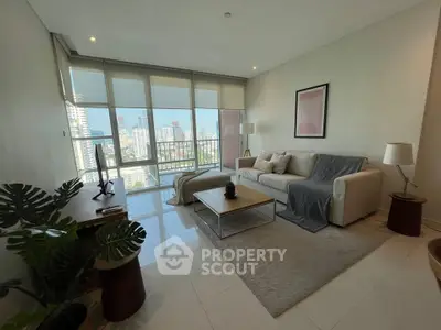 Spacious living room with modern decor and stunning city view