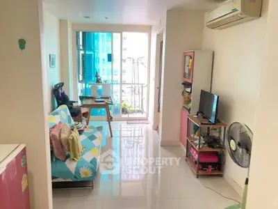 Bright living room with balcony in modern apartment, featuring air conditioning and stylish decor.
