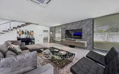 Luxurious modern living room with stylish decor and large windows