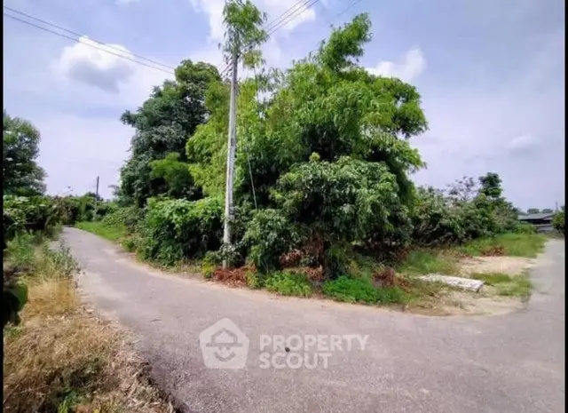 Scenic plot of land with lush greenery and clear skies, ideal for development or investment opportunities.