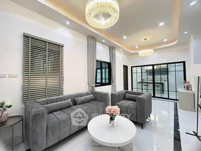 Luxurious modern living room with elegant gray sofas and chic lighting
