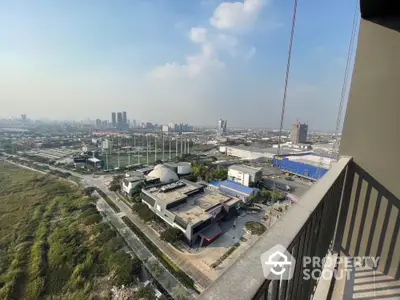 Stunning cityscape view from high-rise balcony with expansive skyline and lush greenery.