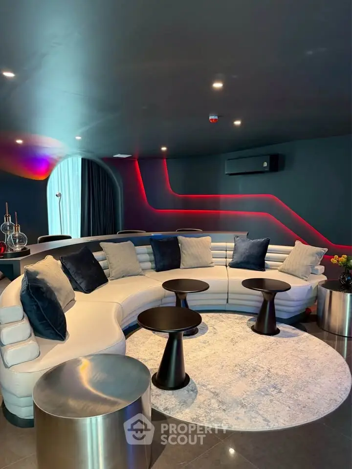 Luxurious modern living room with curved sofa and ambient lighting
