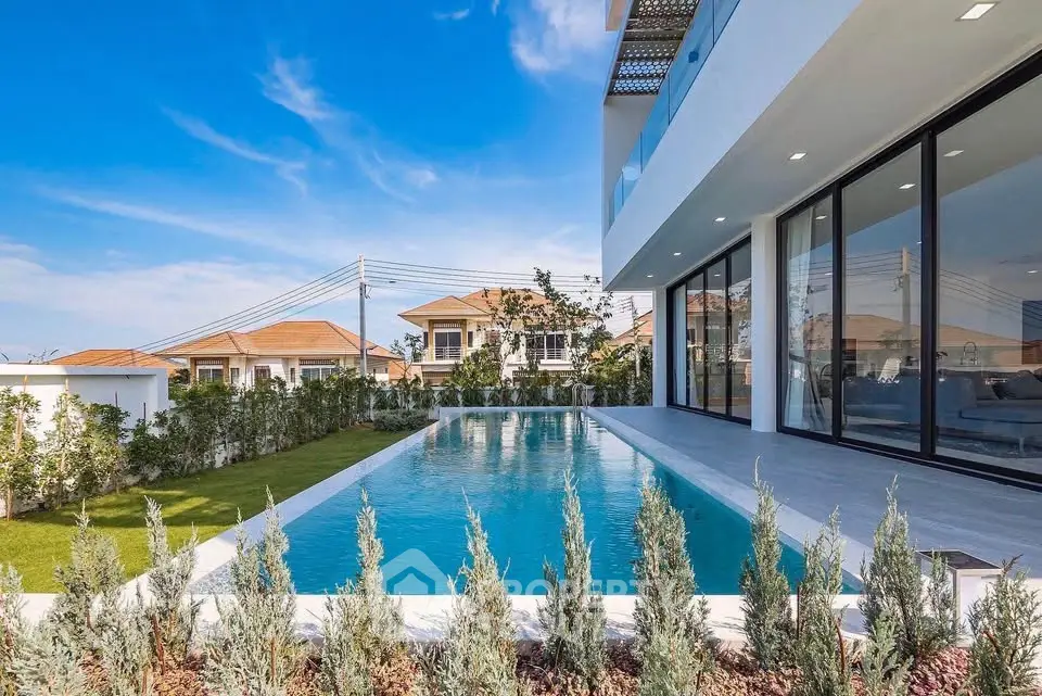 Luxurious modern villa with stunning pool and garden view