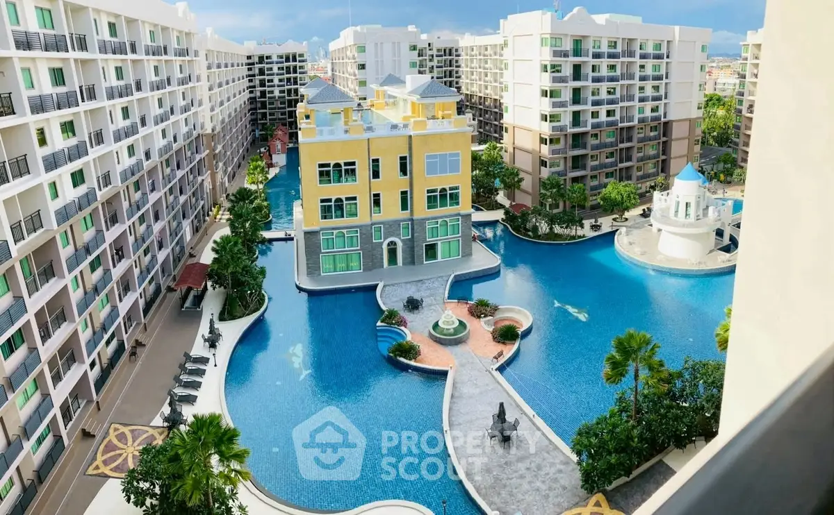 Luxurious condominium complex with stunning pool and modern architecture