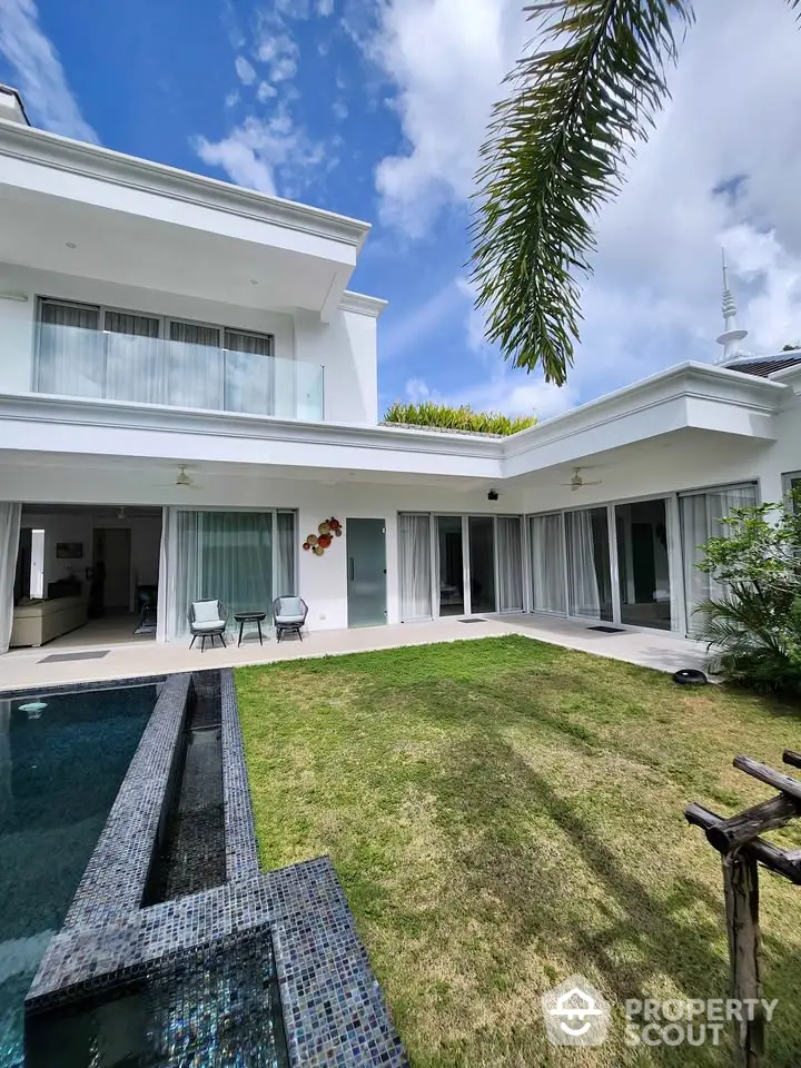 Luxurious modern villa with private pool and lush garden, perfect for serene living.