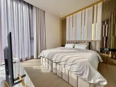 Luxurious bedroom with elegant decor and ample natural light