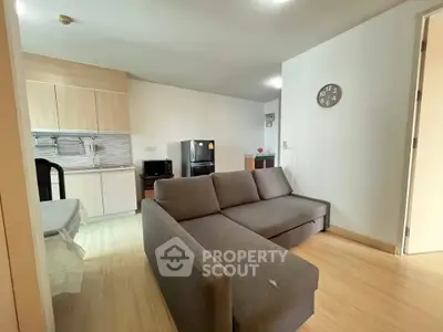 Modern living room with open kitchen and stylish furniture