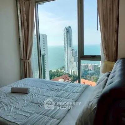 Luxurious bedroom with stunning ocean view in high-rise apartment