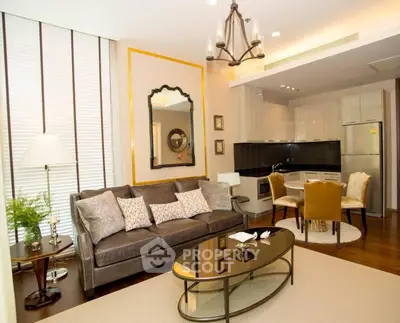 Luxurious living room with elegant decor, modern kitchen, and stylish dining area in an upscale apartment.
